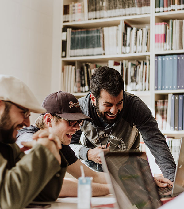Team members happily collaborating in a modern office environment